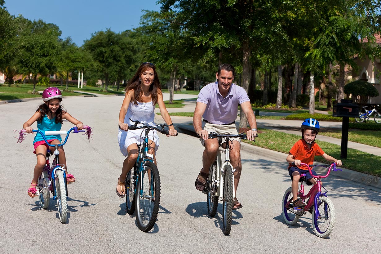 Northeast Florida communities for sale – Family riding bike Northeast Florida communities for sale - Family riding bike